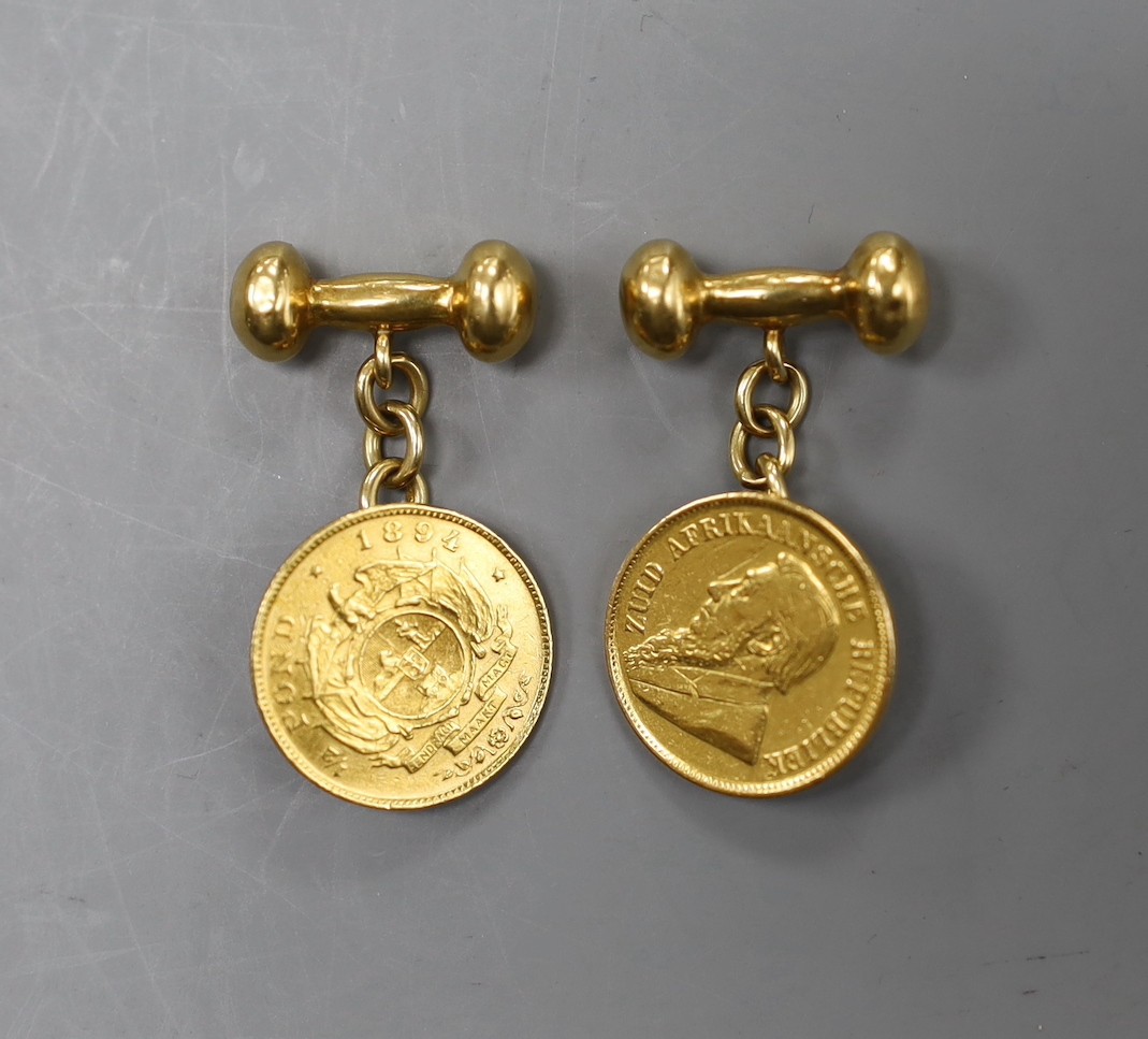 A pair of yellow metal cufflinks, each mounted with a South African 1897 gold pond coin